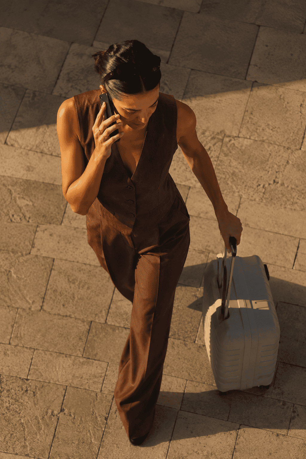 Traveler checking flight details on Getly while walking through the airport